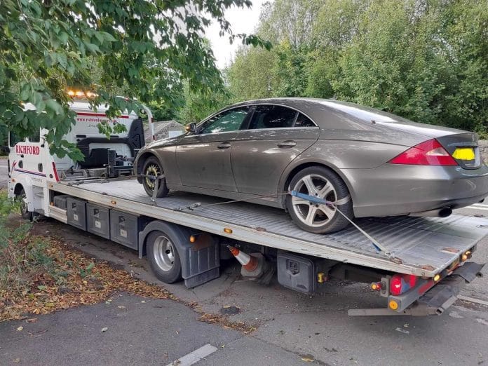 The vehicle was reported to be blocking the view of oncoming traffic for residents on the busy 50mph road
