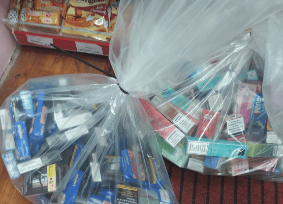 Dodgy Smokes: Seized items from a Derby police raid: over 1,000 cigarettes, hundreds of grams of rolling tobacco, and multiple vapes, valued at nearly £1,700. Dodgy smokes: Seized items from a Derby police raid: over 1,000 cigarettes, hundreds of grams of rolling tobacco, and multiple vapes, valued at nearly £1,700.