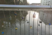 We visited the Derby footbridge with 100s of love locks and were amazed A sea of love locks on the Cathedral Green Footbridge, creating a visual display of commitment in Derby.