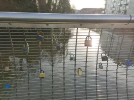 A sea of love locks on the Cathedral Green Footbridge, creating a visual display of commitment in Derby.