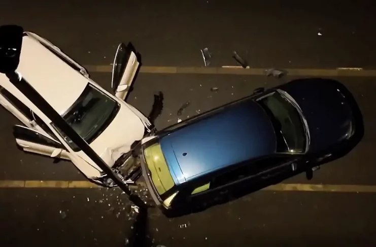 Woman hits parked car in town: The aftermath of the collision on Gower Street, Derby, showing the damaged VW Polo and parked Saab 900.